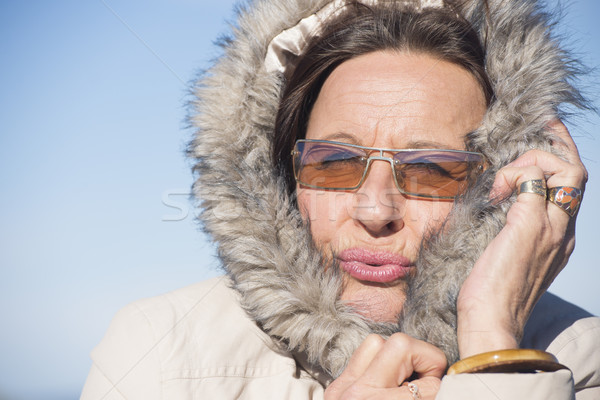Freezing Woman warm winter jacket Stock photo © roboriginal