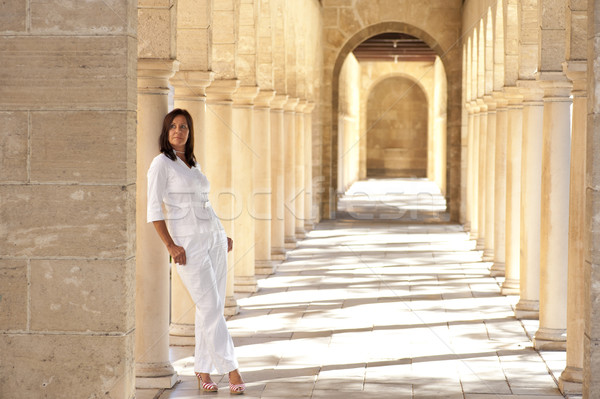 Confident sexy mature woman standing archway Stock photo © roboriginal