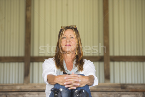 Mature woman sitting relaxed happy outdoor Stock photo © roboriginal