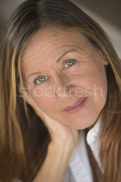 Confident elegant mature woman upward look Stock photo © roboriginal