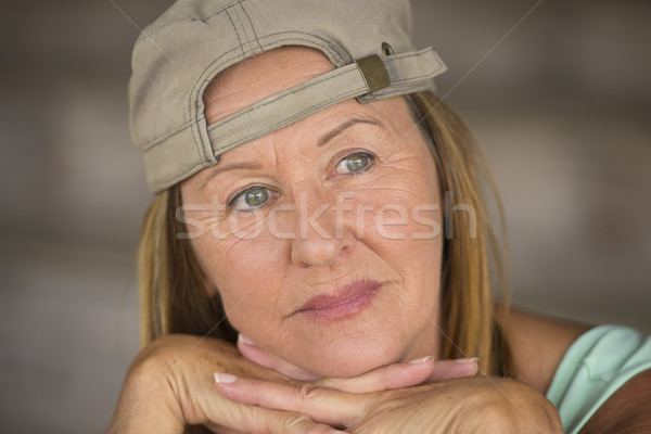 Active fit thoughtful mature woman sporty cap Stock photo © roboriginal