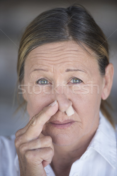 Vrouw neus plug portret ongelukkig Stockfoto © roboriginal