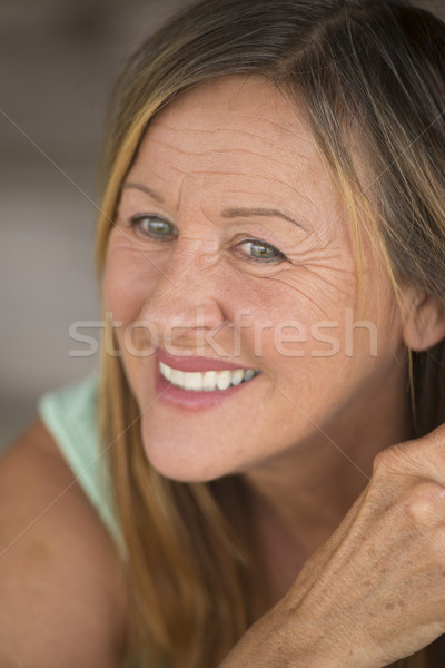 Active confident mature woman smiling Stock photo © roboriginal