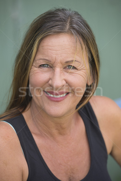 Active fit mature woman happy portrait Stock photo © roboriginal