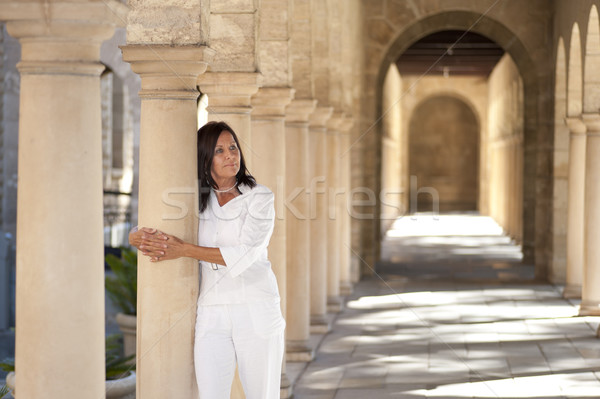 Attractive romantic mature woman archway pillar Stock photo © roboriginal