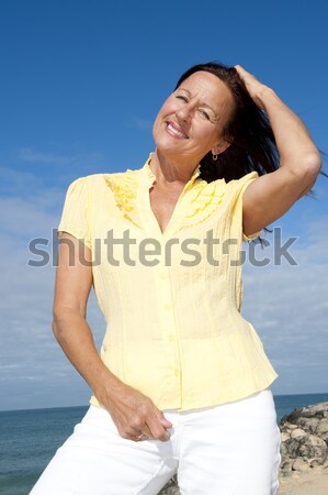 Cheerful senior woman sky background Stock photo © roboriginal