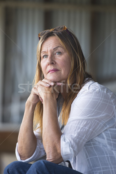Mature woman in thoughtful pose Stock photo © roboriginal