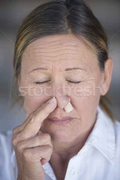 Vrouw neus plug portret ongelukkig Stockfoto © roboriginal