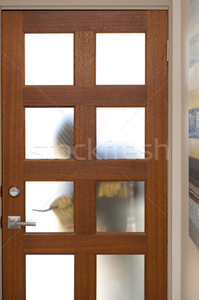 Stock photo: Intruder breaking in house with crowbar