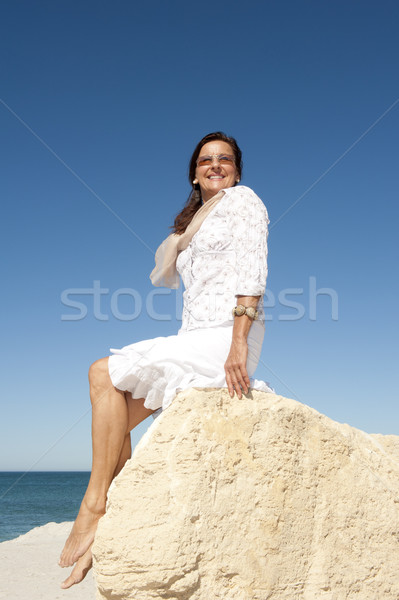 Relaxed senior woman ocean background Stock photo © roboriginal