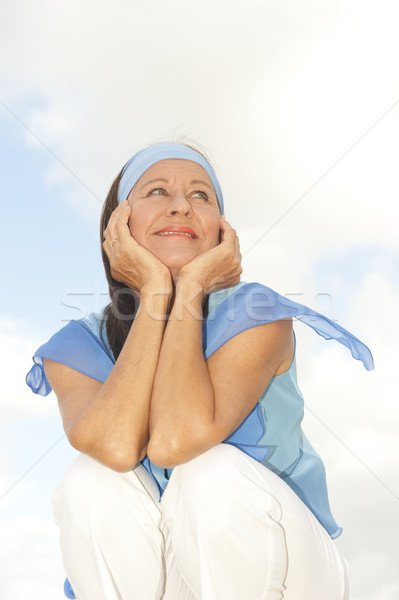 Happy thoughtful middle aged woman outdoor Stock photo © roboriginal