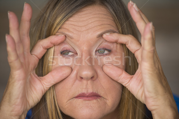 Stressed tired woman worn out expression Stock photo © roboriginal