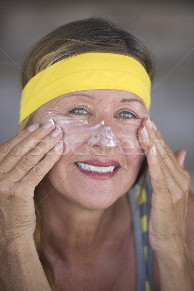 Skin care creme happy mature woman portrait Stock photo © roboriginal