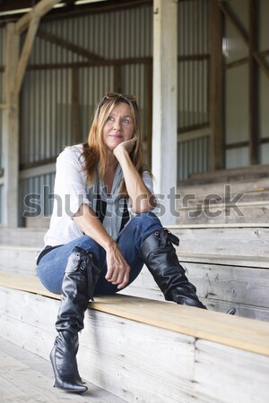 Happy relaxed thoughtful sitting woman  Stock photo © roboriginal