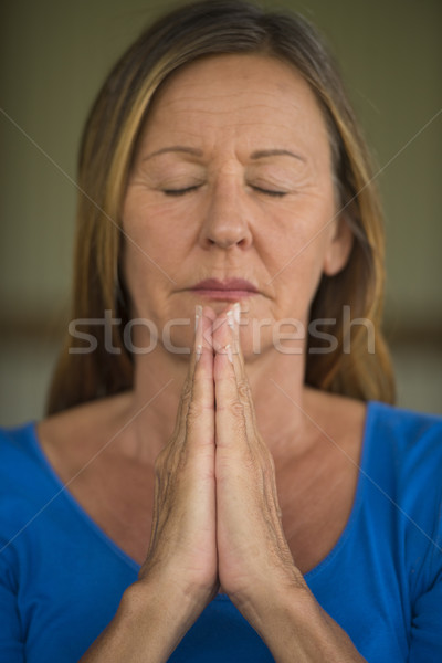 Stock photo: Woman praying closed eyes concentrated