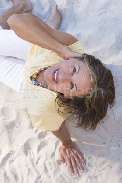 Relaxed happy smiling senior woman beach Stock photo © roboriginal