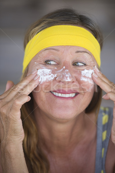 Skin care creme protection mature woman Stock photo © roboriginal