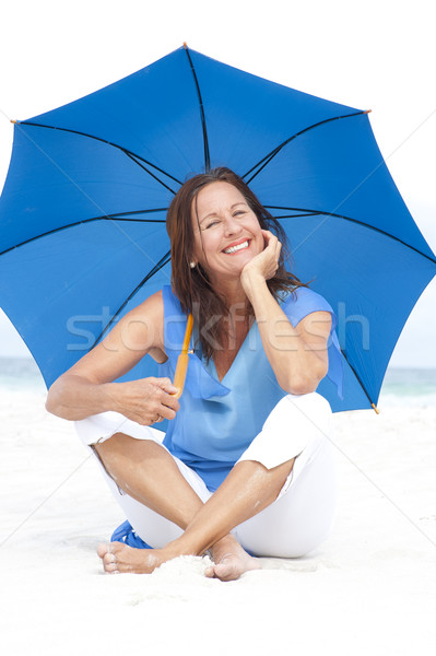 счастливым синий зонтик пляж портрет Сток-фото © roboriginal