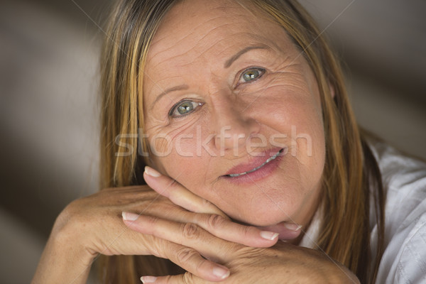 Thoughtful elegant happy mature woman Stock photo © roboriginal