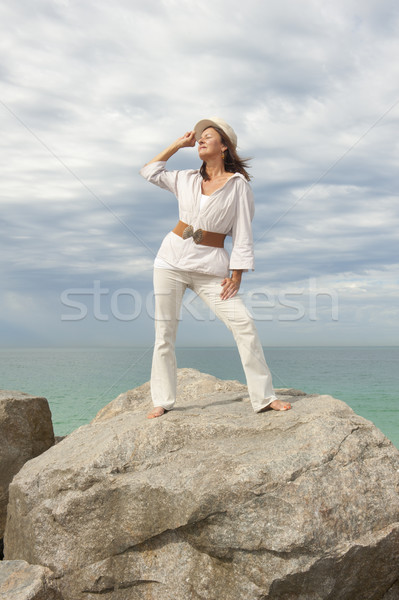 Confident mature woman ocean isolated Stock photo © roboriginal