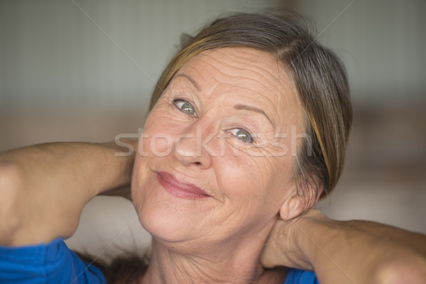 Happy friendly confident senior woman Stock photo © roboriginal