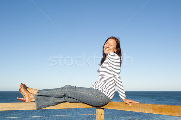 Attractive mature woman ocean background Stock photo © roboriginal
