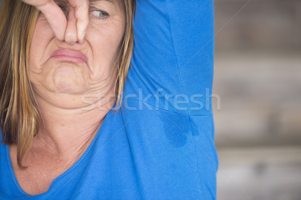 Stock photo: Woman smelly sweat under arm angry
