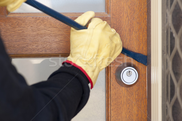 Thief breaking in house with crowbar Stock photo © roboriginal
