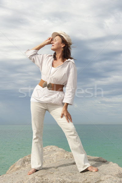 Confident mature woman ocean background  Stock photo © roboriginal