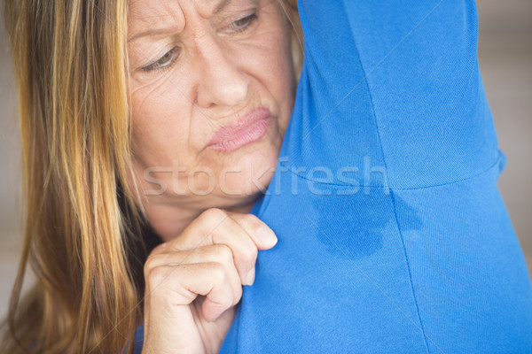 Aktif kadın terleme kol portre olgun kadın Stok fotoğraf © roboriginal