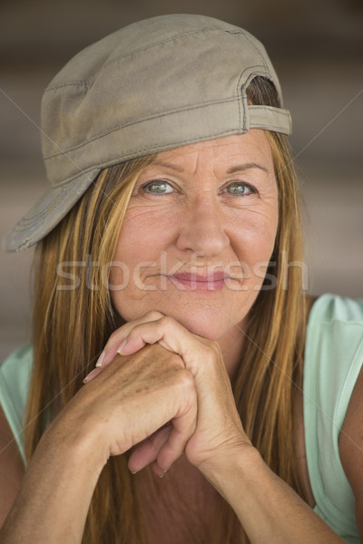 Confident active mature woman sporty cap Stock photo © roboriginal