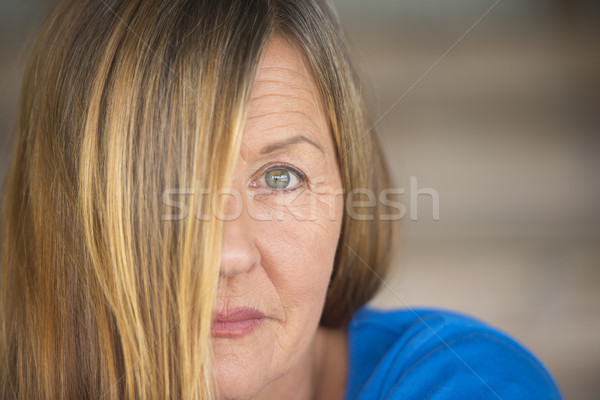 Serious woman hair covering face portrait Stock photo © roboriginal
