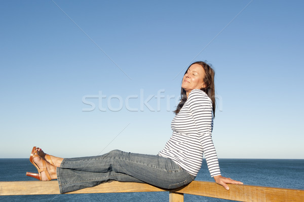 Sexy mature woman ocean background Stock photo © roboriginal