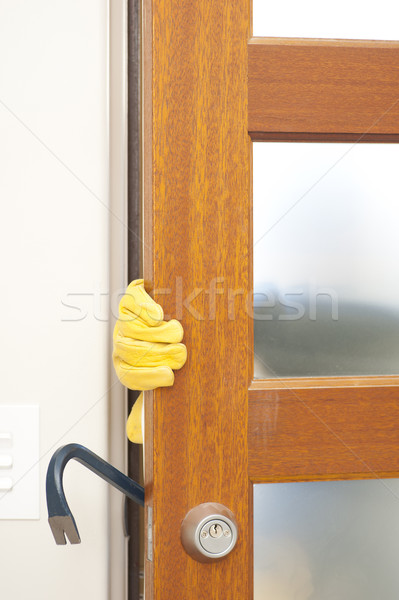 Stock photo: Thief breaking in house with crowbar