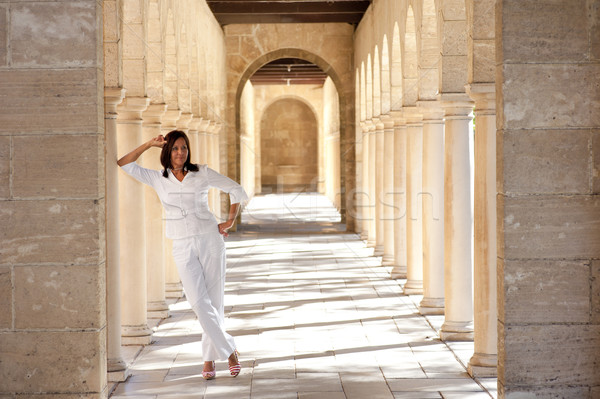 Confident happy mature woman historic archway Stock photo © roboriginal