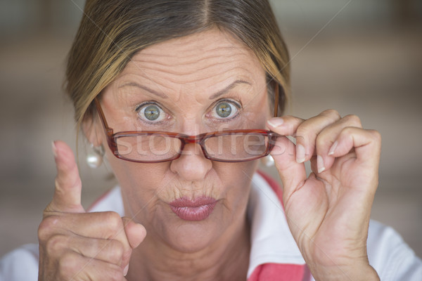 Angry elegant woman with glasses pointing finger Stock photo © roboriginal