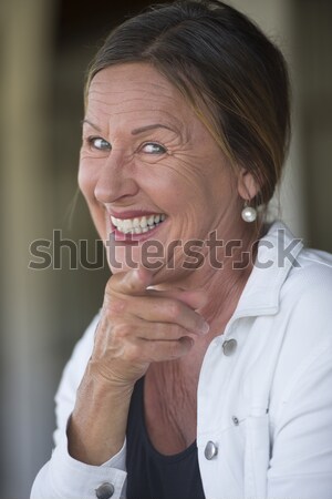 Happy cheeky joyful mature woman portrait Stock photo © roboriginal