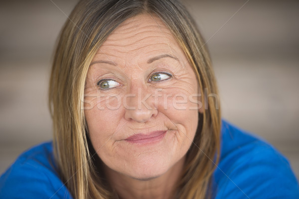 Cheeky smiling woman portrait Stock photo © roboriginal