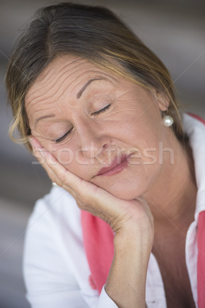 Sleepy mature woman closed eyes relaxed Stock photo © roboriginal