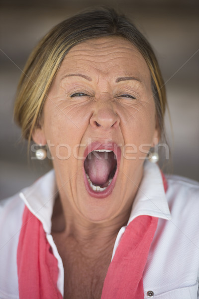 Tired yawning mature woman portrait Stock photo © roboriginal