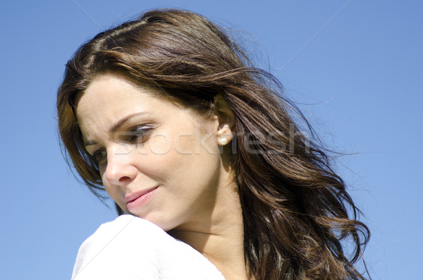 Sad young woman isolated on blue outdoor Stock photo © roboriginal