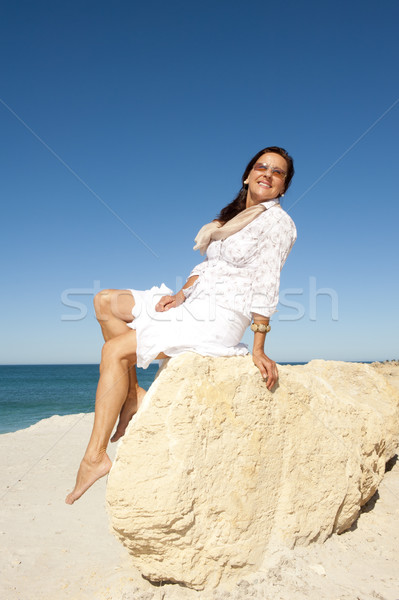 Mature woman happy at beach Stock photo © roboriginal