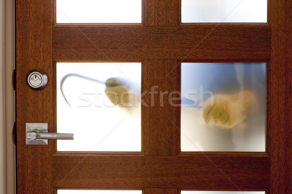Stock photo: Burglar with crowbar at house door 