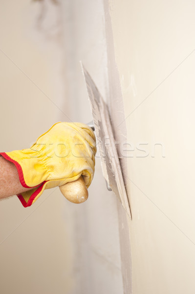 Home renovation wall with scraper and cement Stock photo © roboriginal