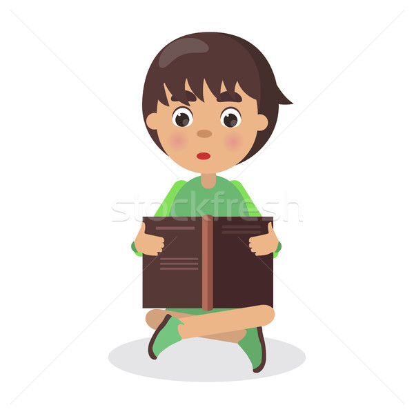 Boy Sits in Yoga Pose with Open Book and Read Stock photo © robuart
