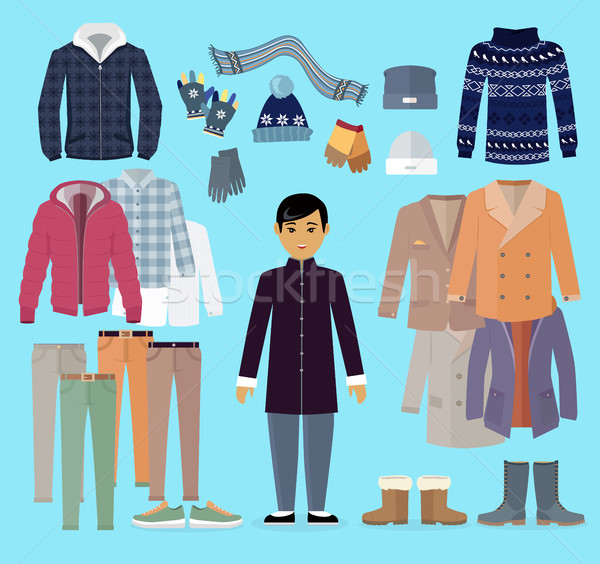 Stock photo: Boy in Warm Clothes Stands in Centre on Blue.