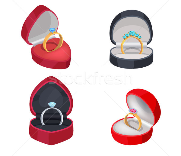 Four Rings with Precious Stones in Gift Boxes Stock photo © robuart
