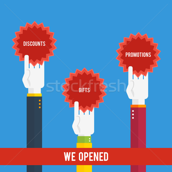 Grand opening - hands holding stickers Stock photo © robuart