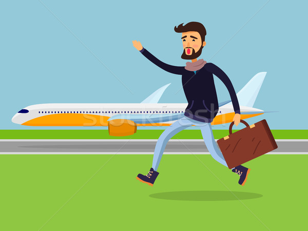 Man with Suitcase Running to Passenger Plane. Stock photo © robuart