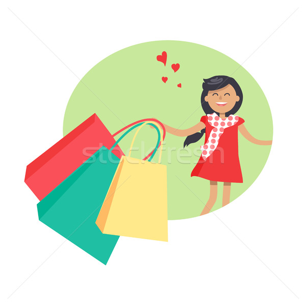 Purchasing Concept with Smiling Girl Holding Packs Stock photo © robuart